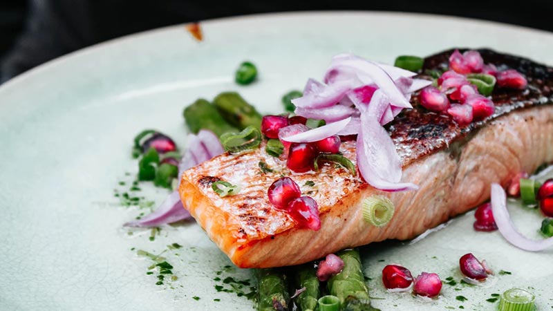 Salmon steak topped with garnish